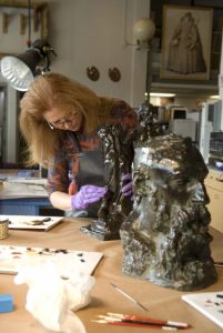 Art-Conservation-workers restores bronze bust