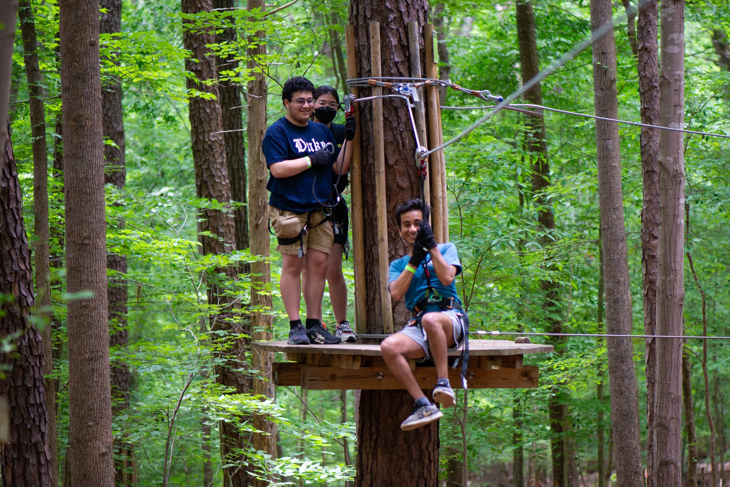 Huang Fellows tackle a ropes course together