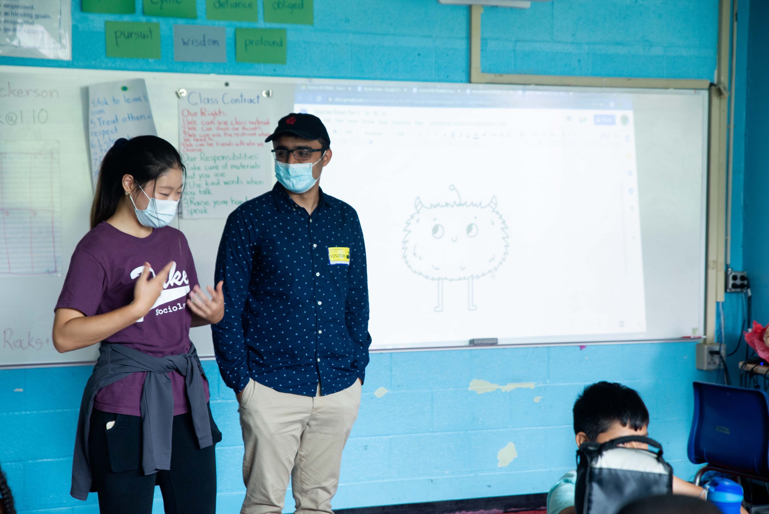 The Huang Fellows present their science kits at Holt Elementary School