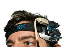 Man with Brain Scanning Machine connected to his head 