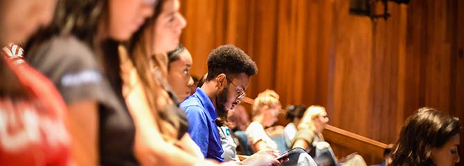 Duke University students sit in class