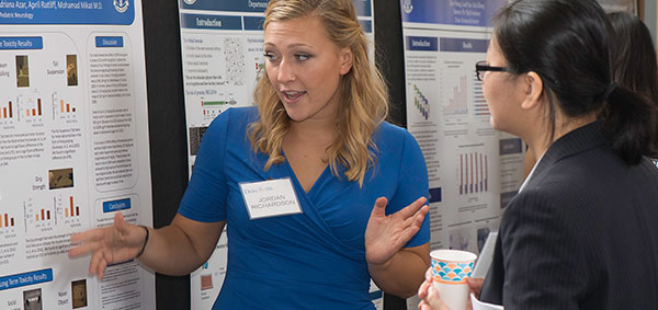 Jordan Richardson presents her research during a poster session at Duke